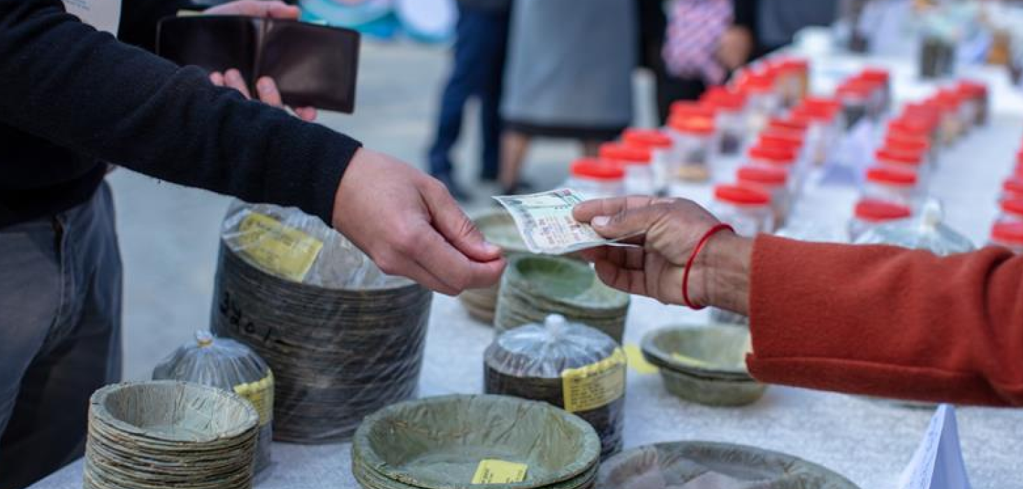 Market event with people viewing produce and food items